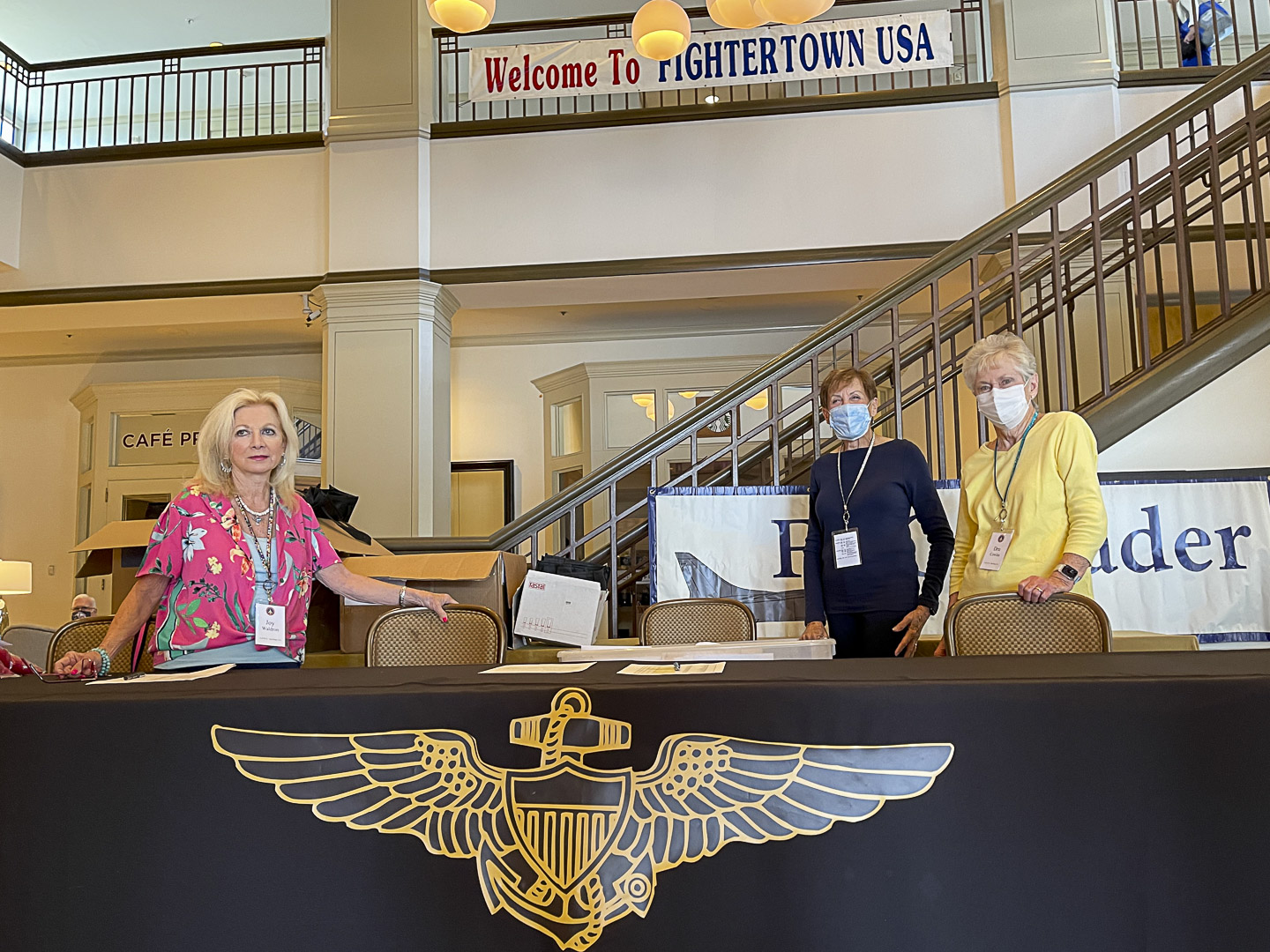 Joy Waldron, Dede Ozbirn, and Dru Cowles at the check-in table